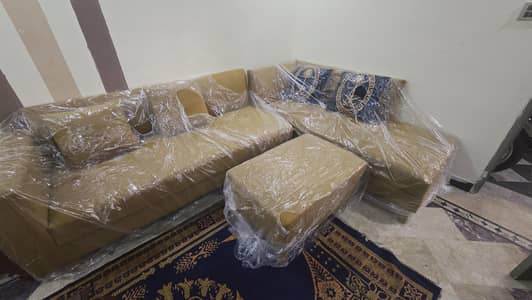 L shaped sofa with puffy and cushions