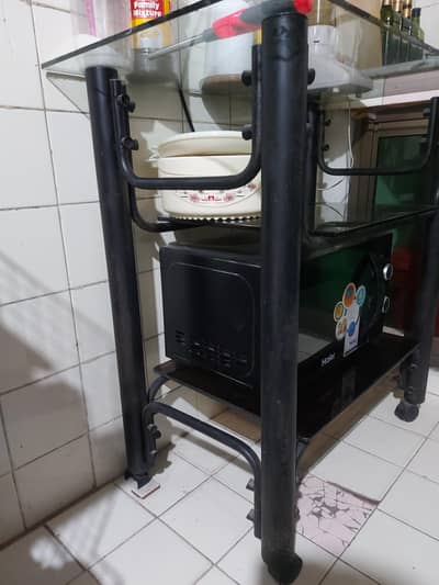 Glass table with metal body. three tier  . can use in kitchen also