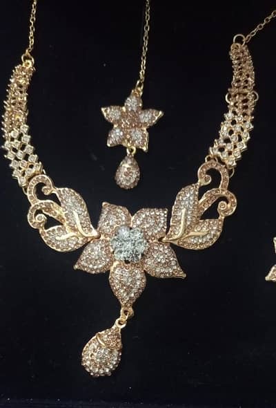 Elegant Golden Necklace set with Earrings & Tikka Bridal/ Party wear