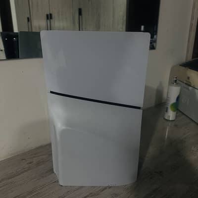 ps5 with game and controllers