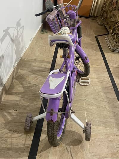 Barbie bicycle four wheeler used  1 year purple colour