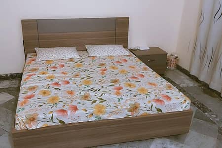 almost new Formica wood with mattress.