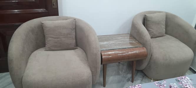 Stylish brown chairs with brown center table set