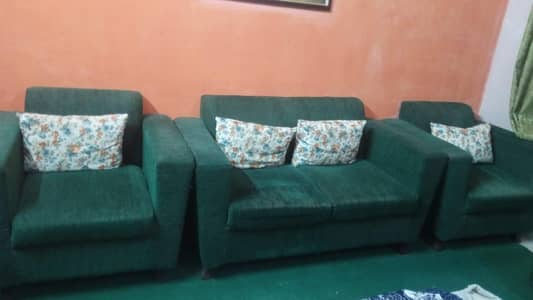 Dark green sofa set 4 seater with two Puffy