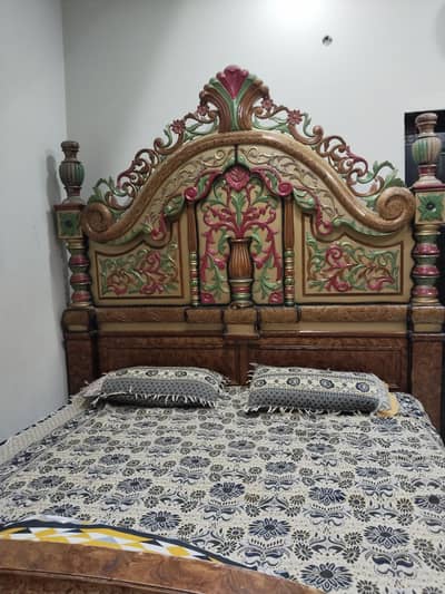 king size double bed with side table