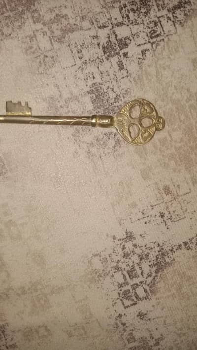 this is a antique key made from totally silver and a code on key head