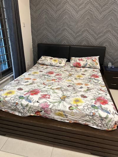 Bed with side tables and spring mattress
