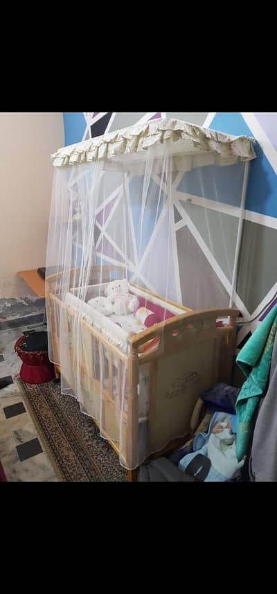 Large baby cot with swinging crib