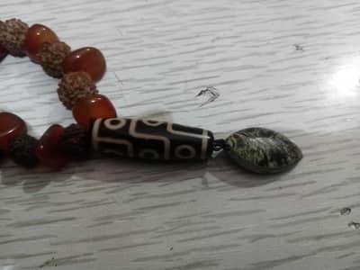 antique beads + rudrakhs + aqeeq + silver pendant