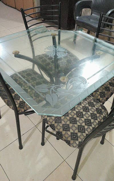 4 seater glass dining table with strong metal frame and 4 chairs