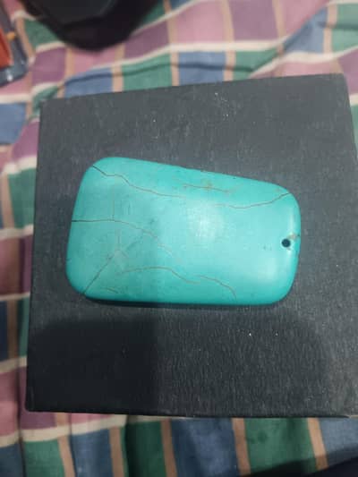 This item is a turquoise stone pendant