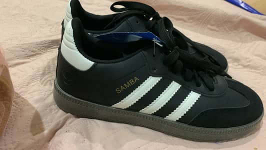 These are adidas samba in black colour size 41