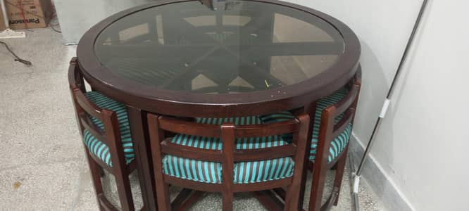 A dining table and six chairs for sale
