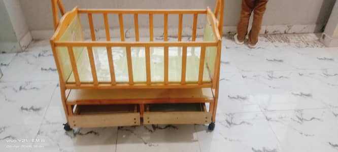 A beautiful baby swing cot.