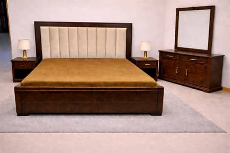 bed with two side tables and dressing table
