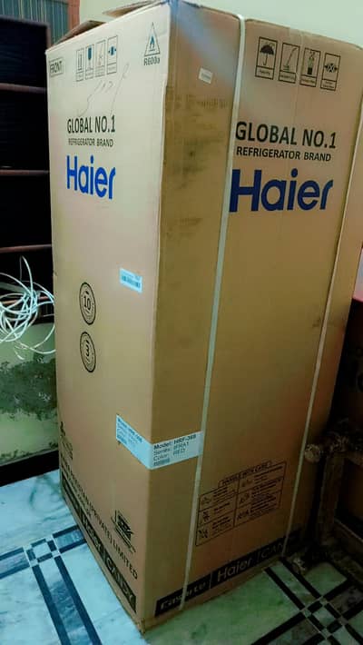 Haier refrigerator. box pack medium size warranty card ke sath