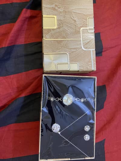 Box of necklace, earring and watch