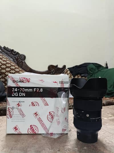 Sigma 24-70 Lens Good Condition 100% working. With Box.