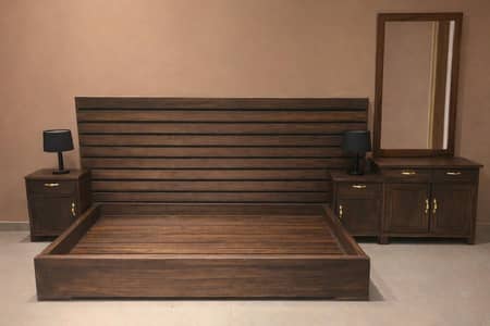 wooden bed with two side tables and dressing table