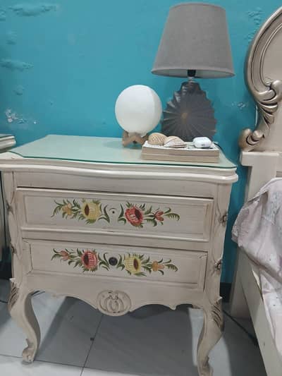 bed with side table and dressing table