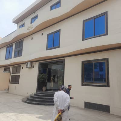 2 kanal coner triple story commercial building for rent with 16 kv soller system ka sath