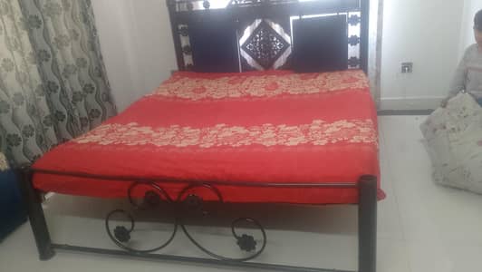 iron bed in good condition without mattress . .