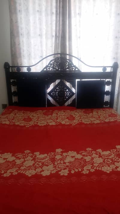 iron bed in good condition without mattress . .