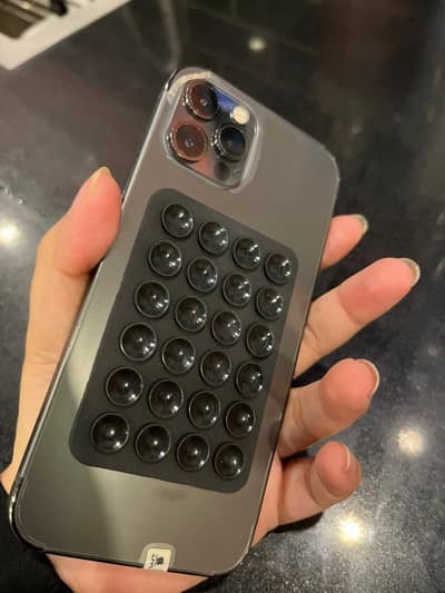 iPhone 12 Pro for sale with three iphone covers