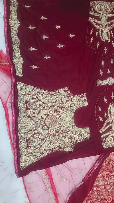 Luxury Maroon Lehnga with heavy Hand embroidery. Unstitched Bridal