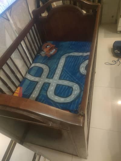 wooden bed with mattress