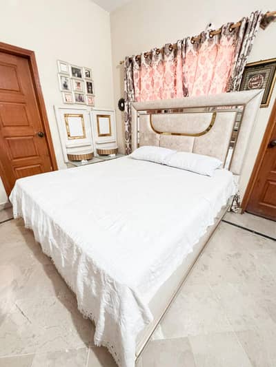 A bed set ( without mattress ) with dressing table and wardrobe