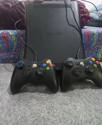 Xbox 360 (jail break) like new with two controlers and all accessories