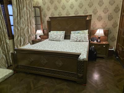 Elegant solid wood bed set with side tables and dresser
