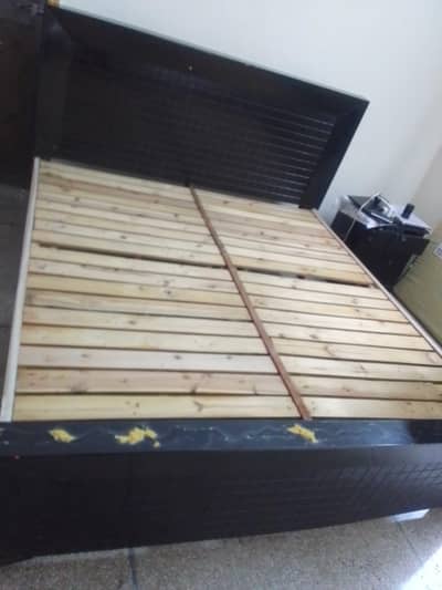 king bed with some de tables