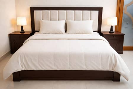 wooden bed with two side tables