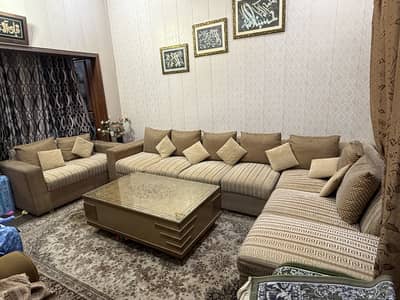9 seater L shaped sofa with centre table