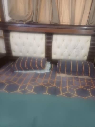 king bed with side table and dressing tablr