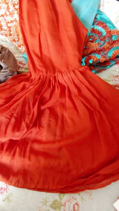 Its a short net gown with jamawar inner and chiffon gharara