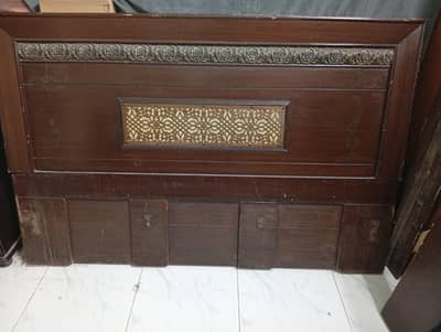 wooden bed with mattress