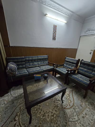 blue fabric L shaped sofa