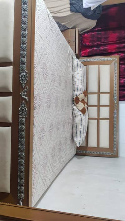 double bed with 2 side table and mirror table