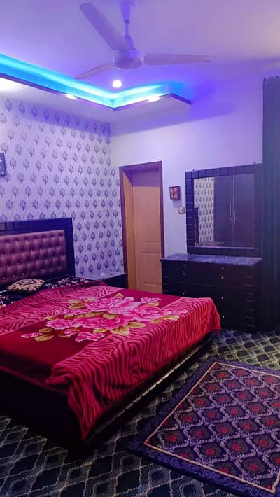 wooden bed with side tables and dressing table