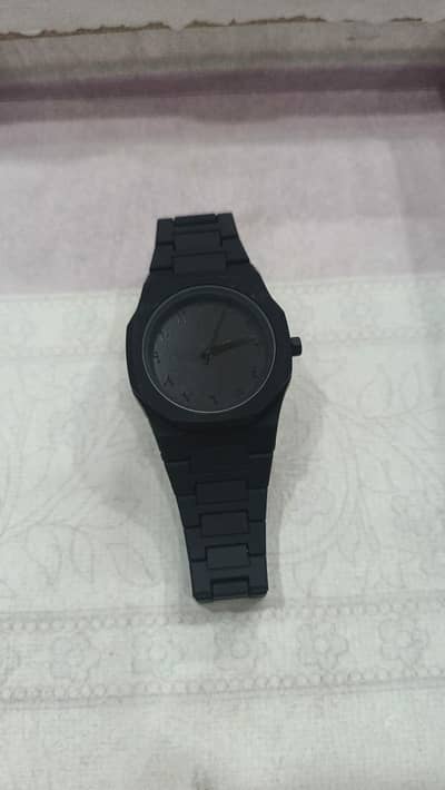 Black minimalist analog wrist aura watch with stainless steel strap