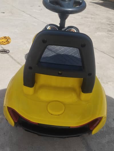 kids cycle and a toy car for sale