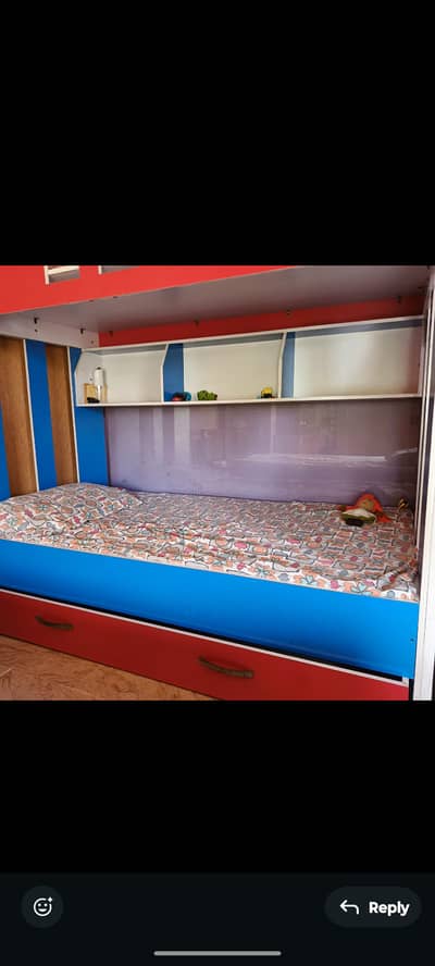 Stylish, vibrant bed for sale, has the capacity of three mattresses.