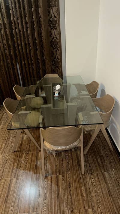 6 Chairs + Dining Table Set available in brand new, unused condition.