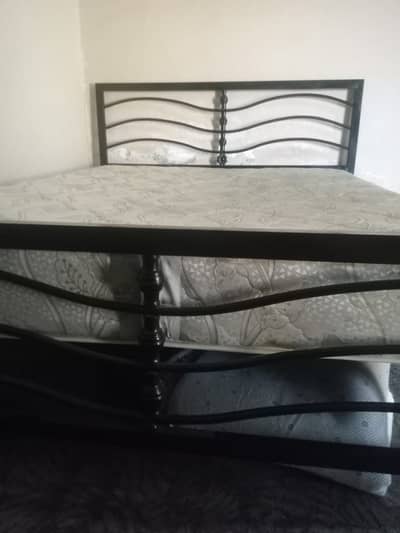 Rott Iron Bed with a double spring mattress.