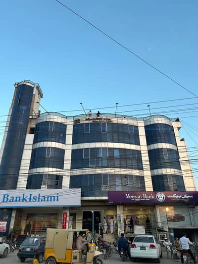 SHOP FOR RENT ADYALA TOWER, Rawalpindi. Ideal For Pharmacy, Clinic, Or Retail. Spacious Shop With Glass Door, Bright Lighting, On Main Road With Parking. CCTV-Enabled, Rs. 75,000/Month.