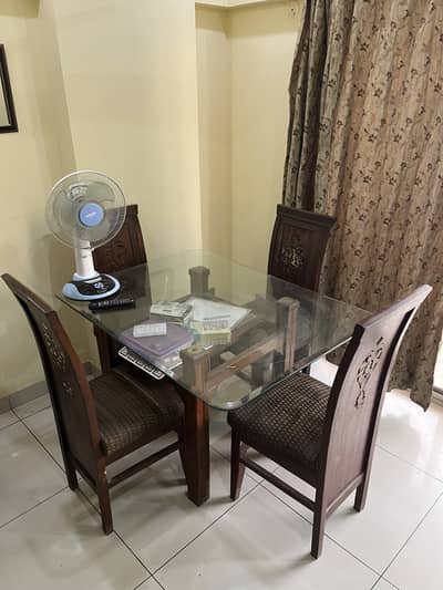 4 Chairs and A Glass top Wooden dining Table