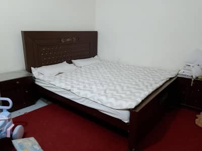 bed with side table and dressing